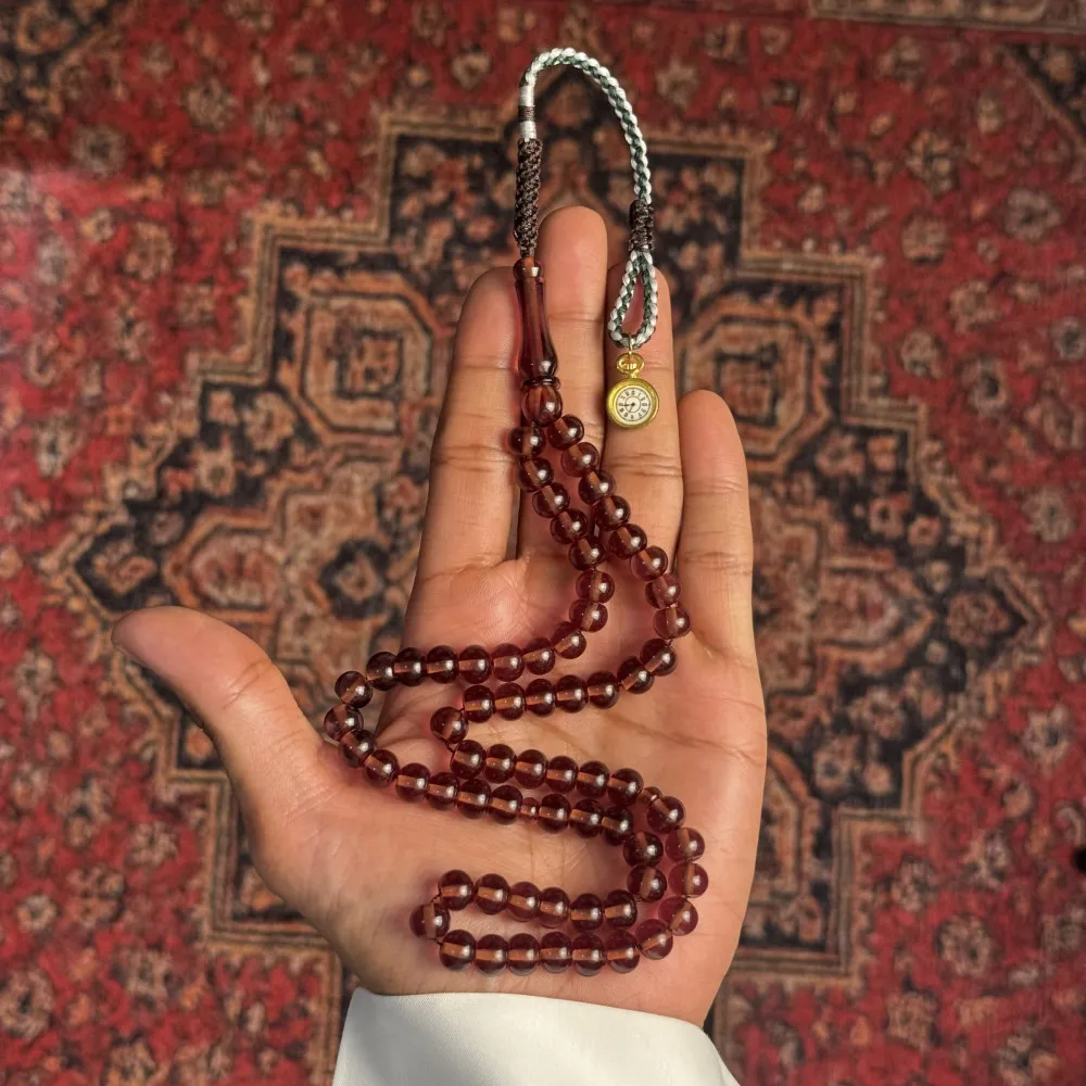 مسباح بكلايت – عنابي شفاف، شرابة فضية مسباح بكلايت – عنابي شفاف، شرابة فضية