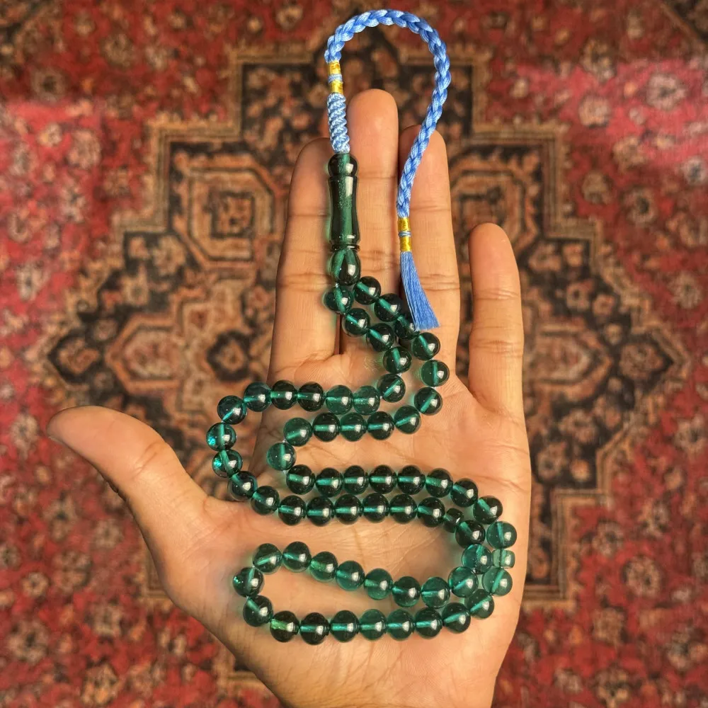 Saffron Tasbih – Green translucent, light blue tassel Saffron Tasbih – Green translucent, light blue tassel